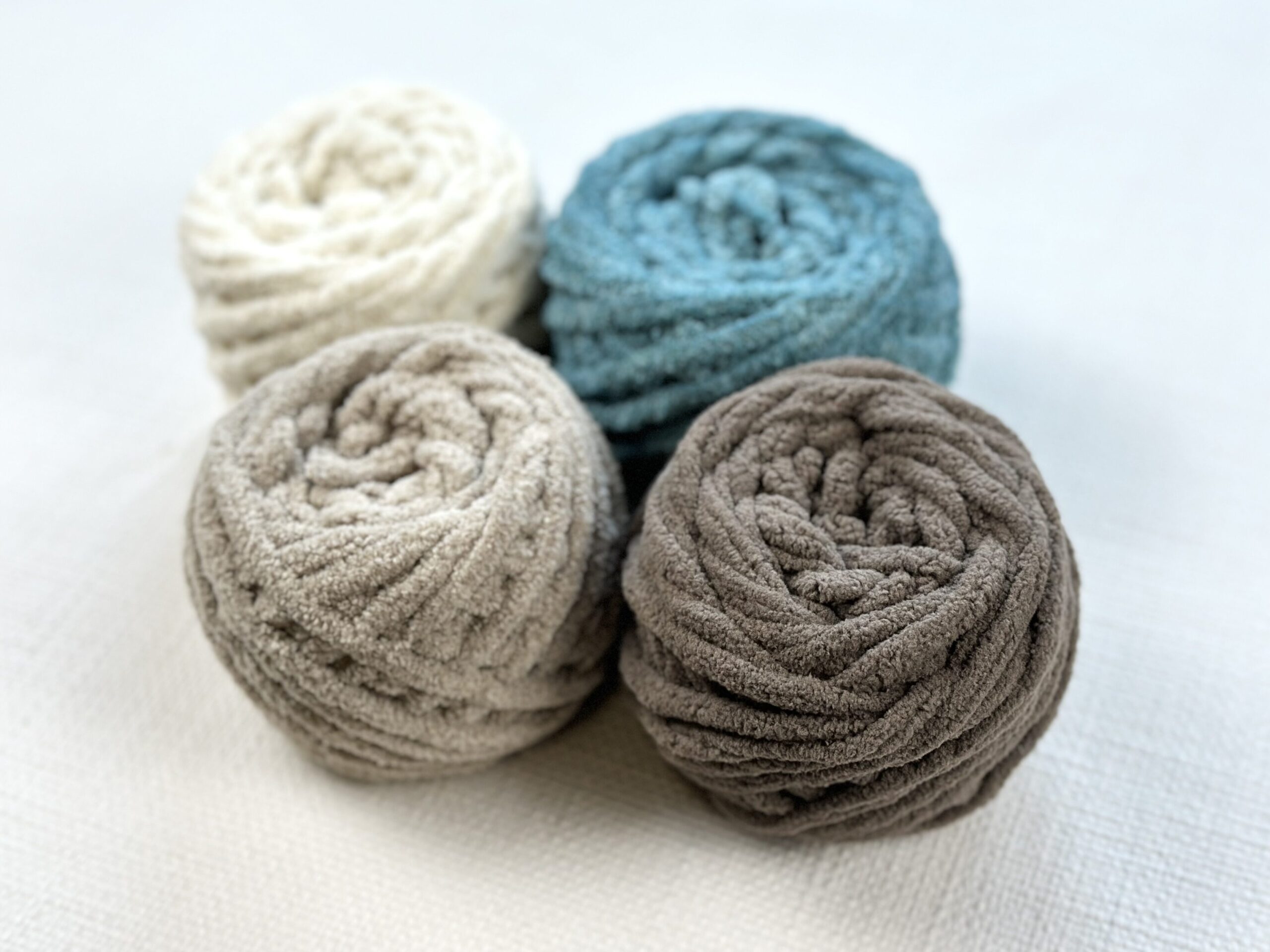 Cluster of multi colored Bernat blanket yarn. 