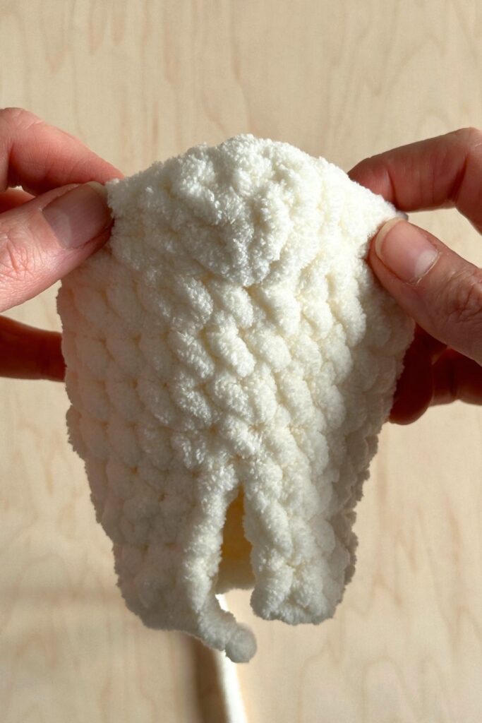 Process photos of Finn Bear's chicken costume. Showing how to crochet the tail onto the body.