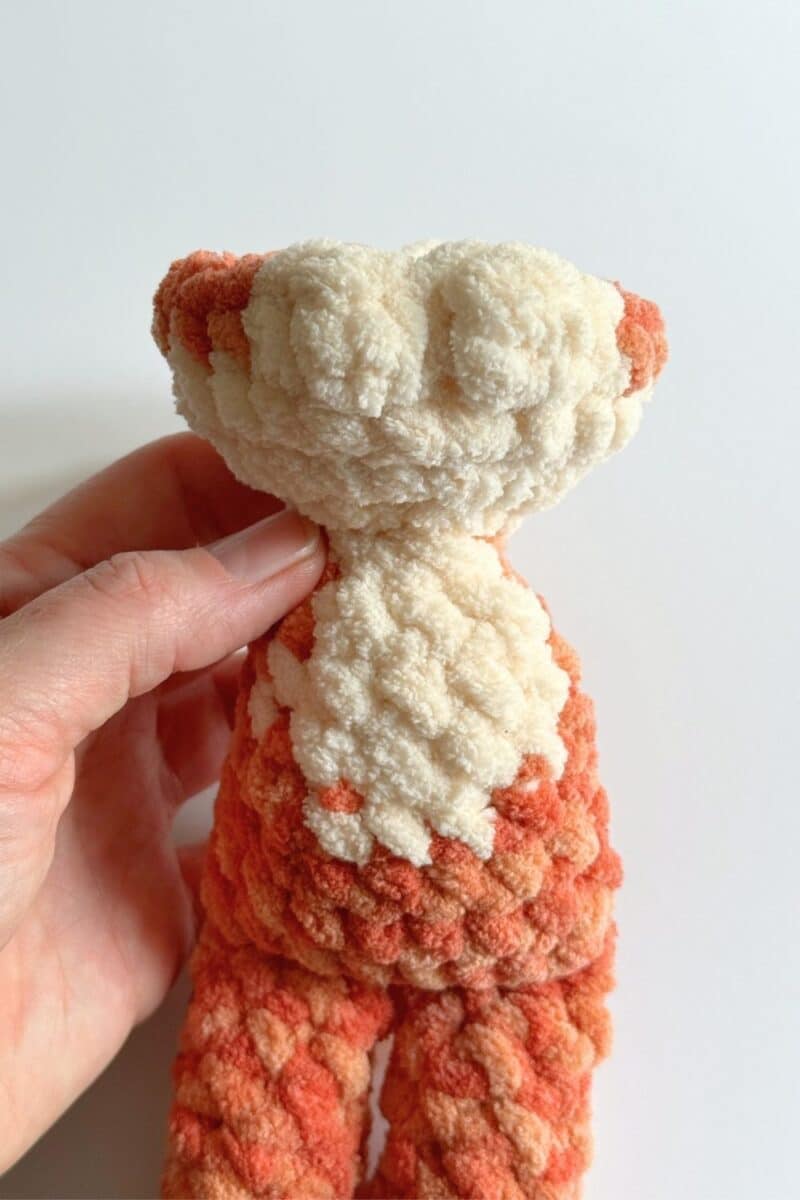 Process photo of the bobble stitches on round 4 of the head on a crochet cat pattern.