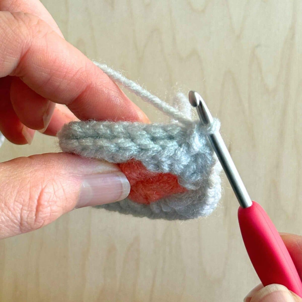 First stitch worked to secure both sides of the square.