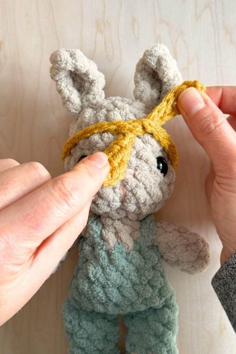 Second step of tying the headband onto the head.