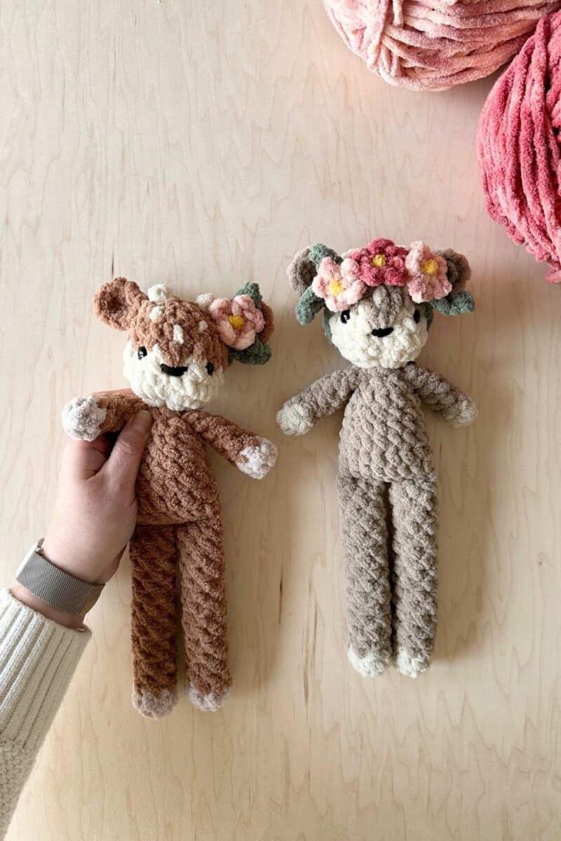 Two crochet fawns with flower headbands.