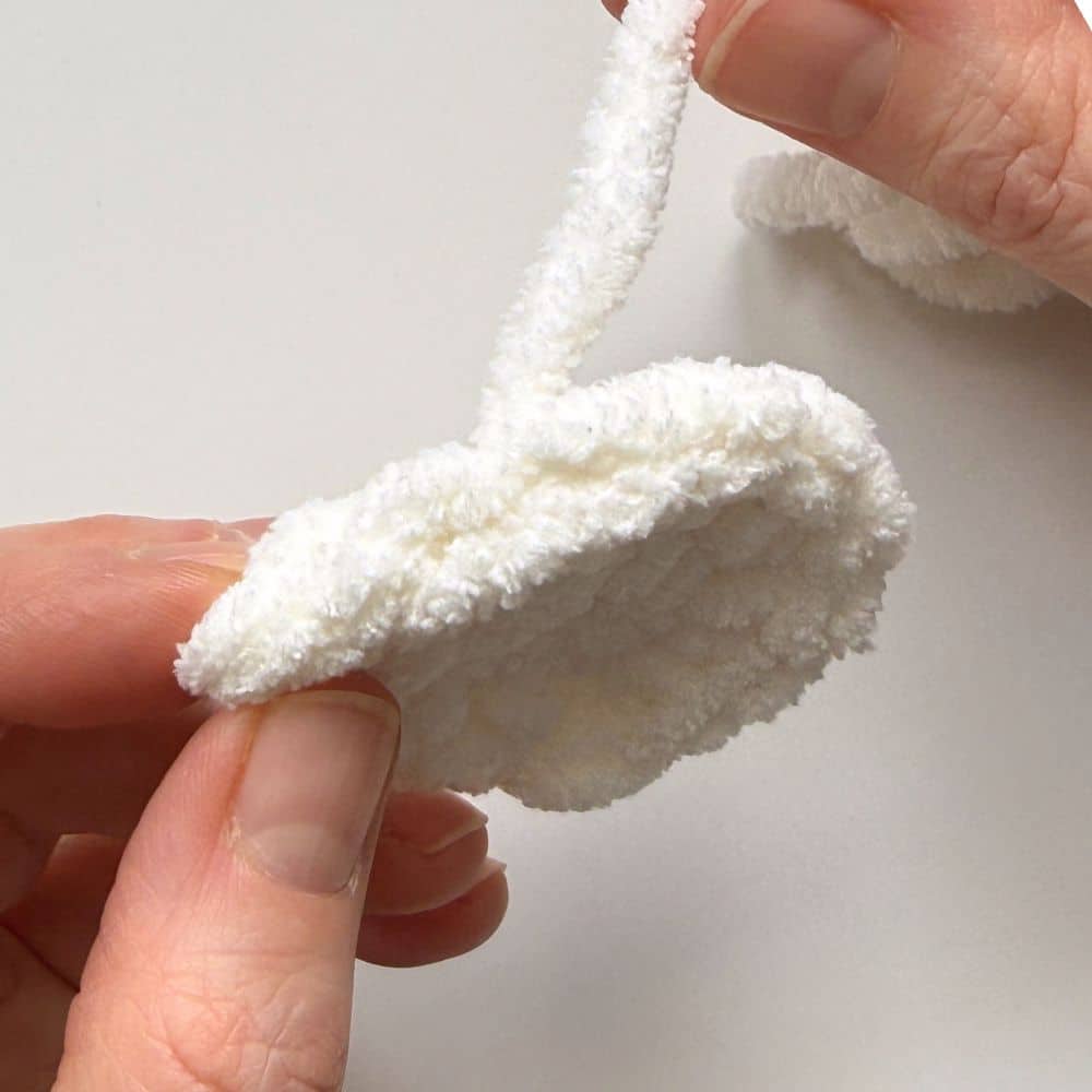 Finishing step to complete the crochet wing.