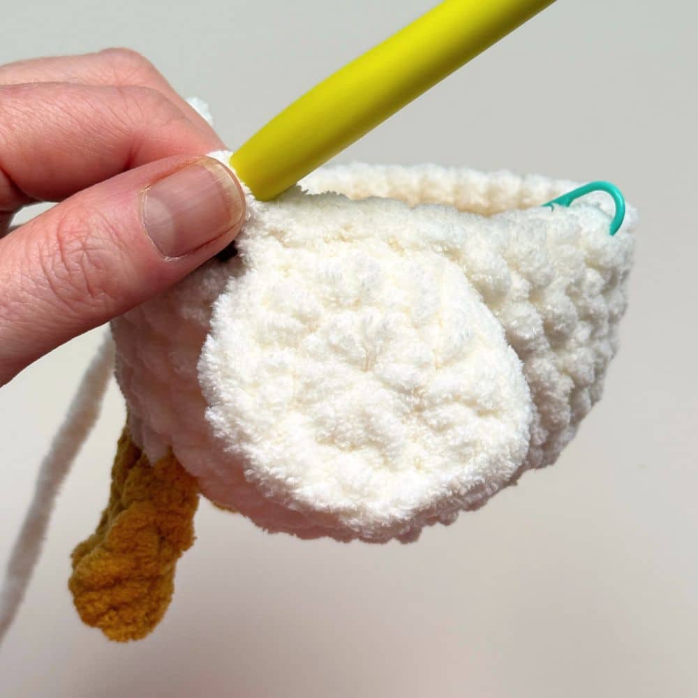 Photo showing the goose wing crocheted into the goose body.