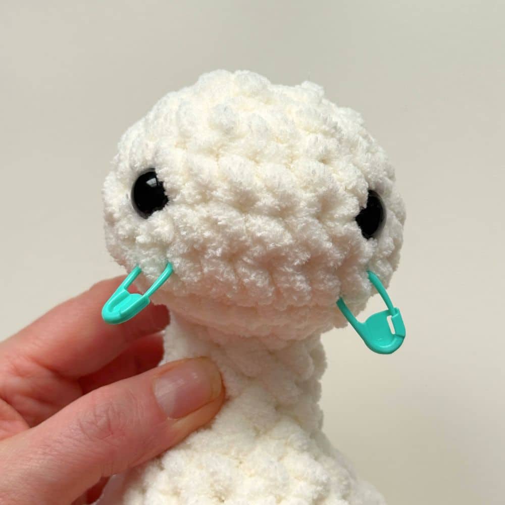 Stitch marker placement on the head where the beak will go.