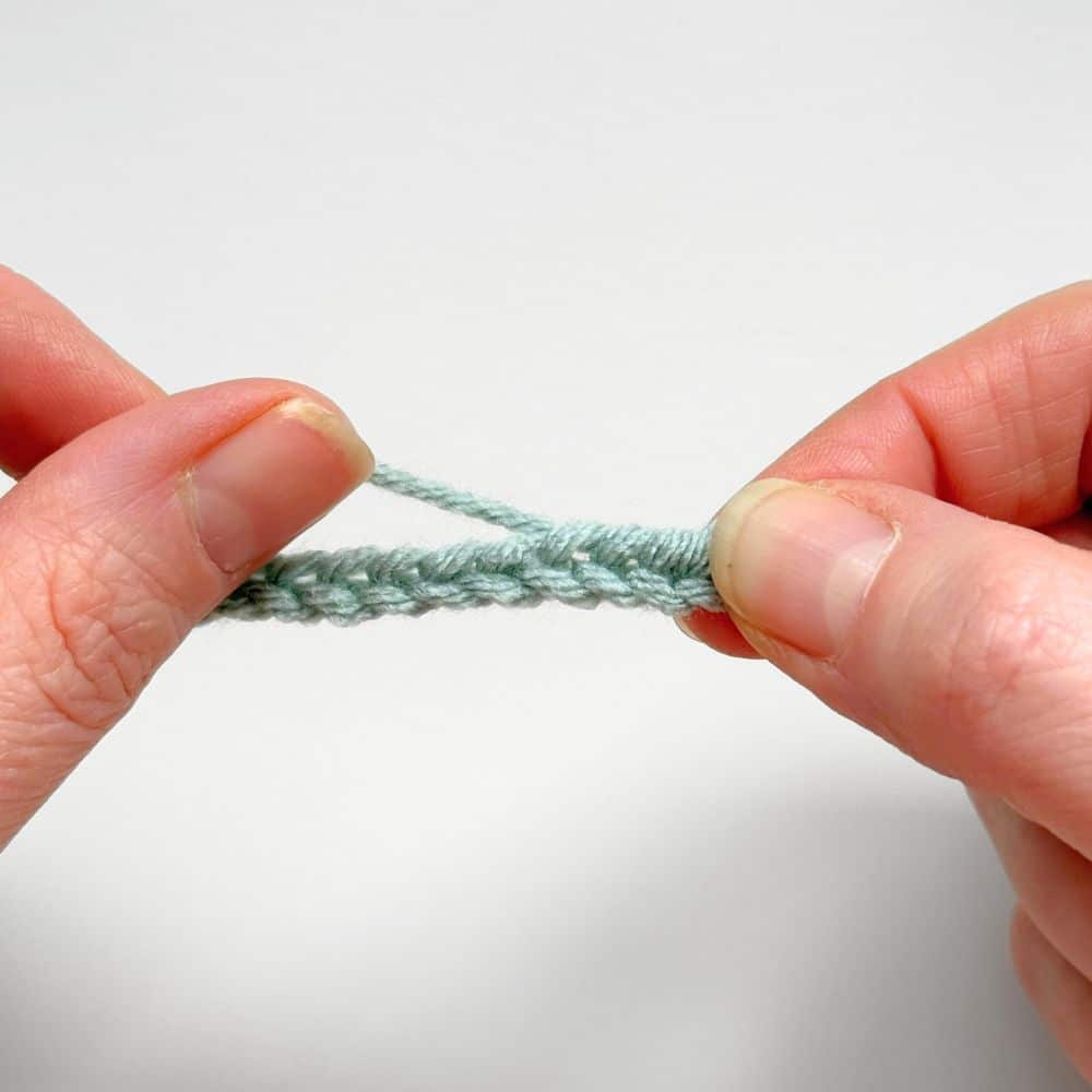 Second step in adding the knot to the ties.