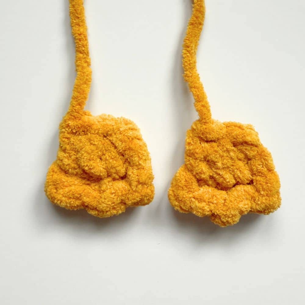 Two completed crochet goose feet.