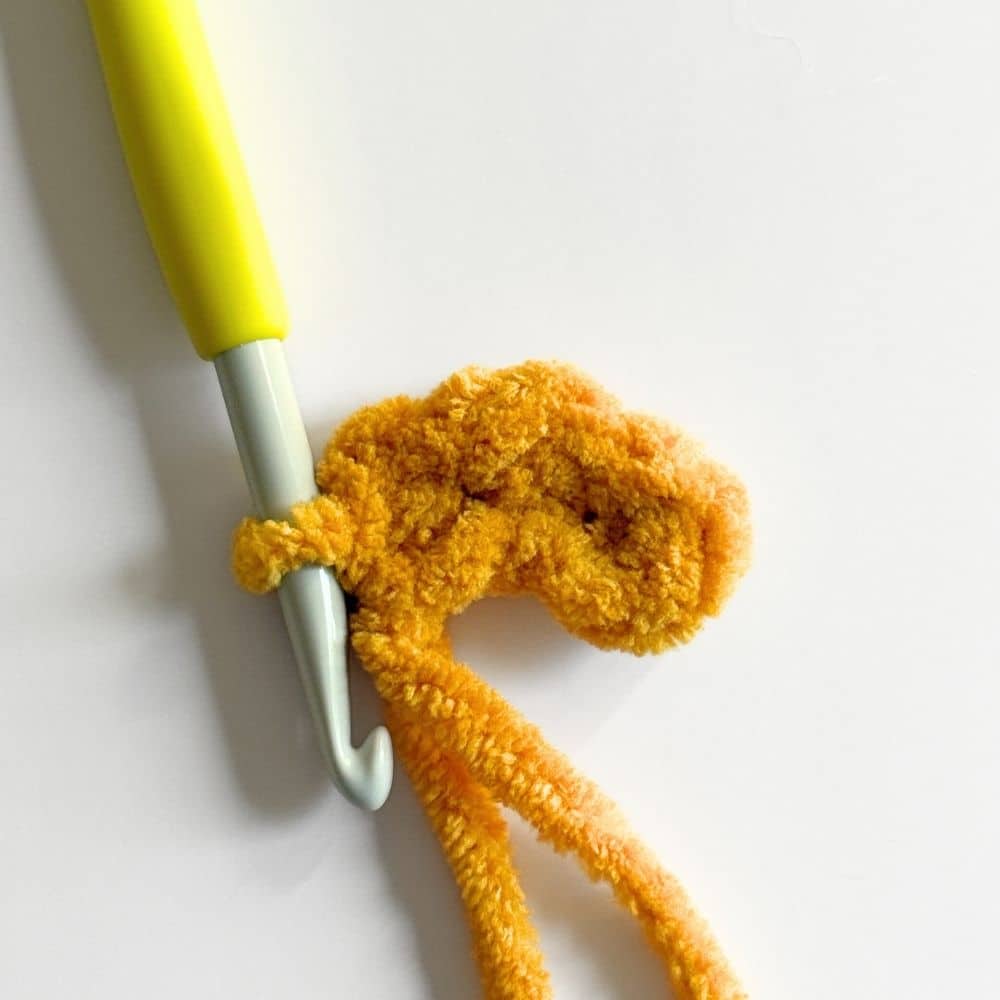 Process photo of stitches worked into a chain.