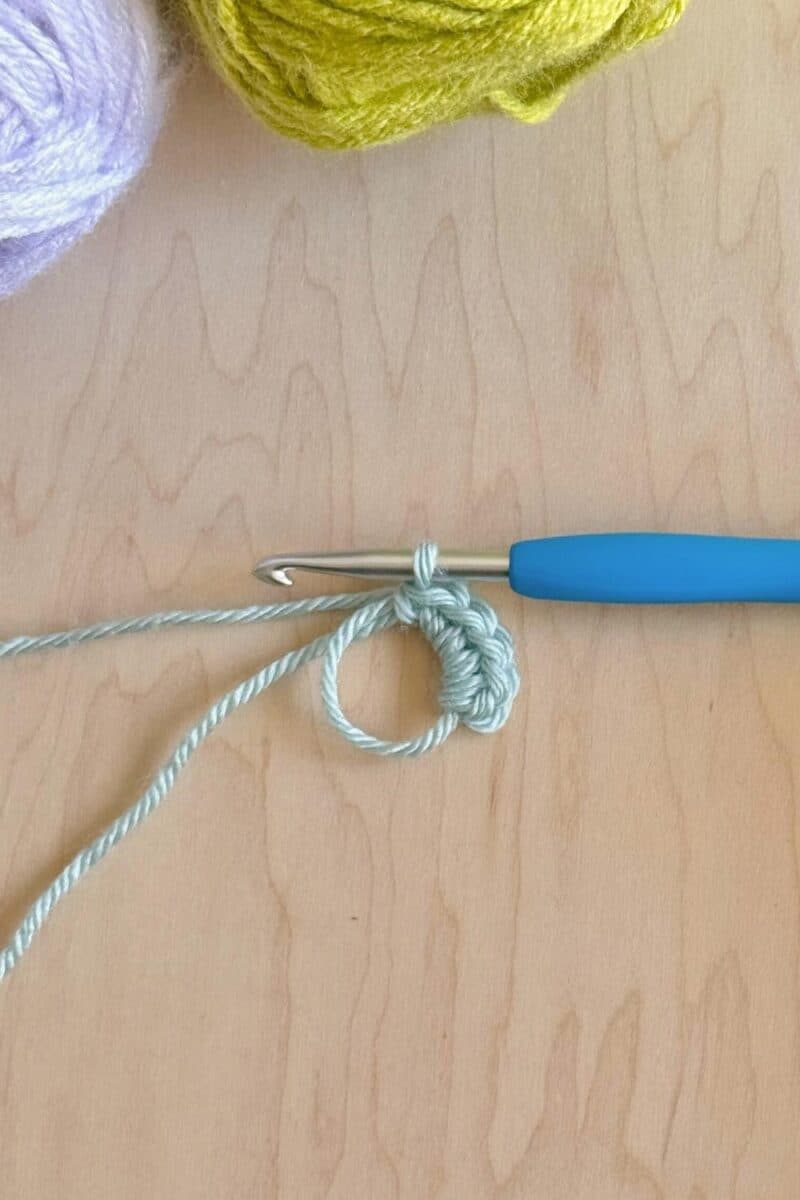 Process photo showing a crochet magic circle.