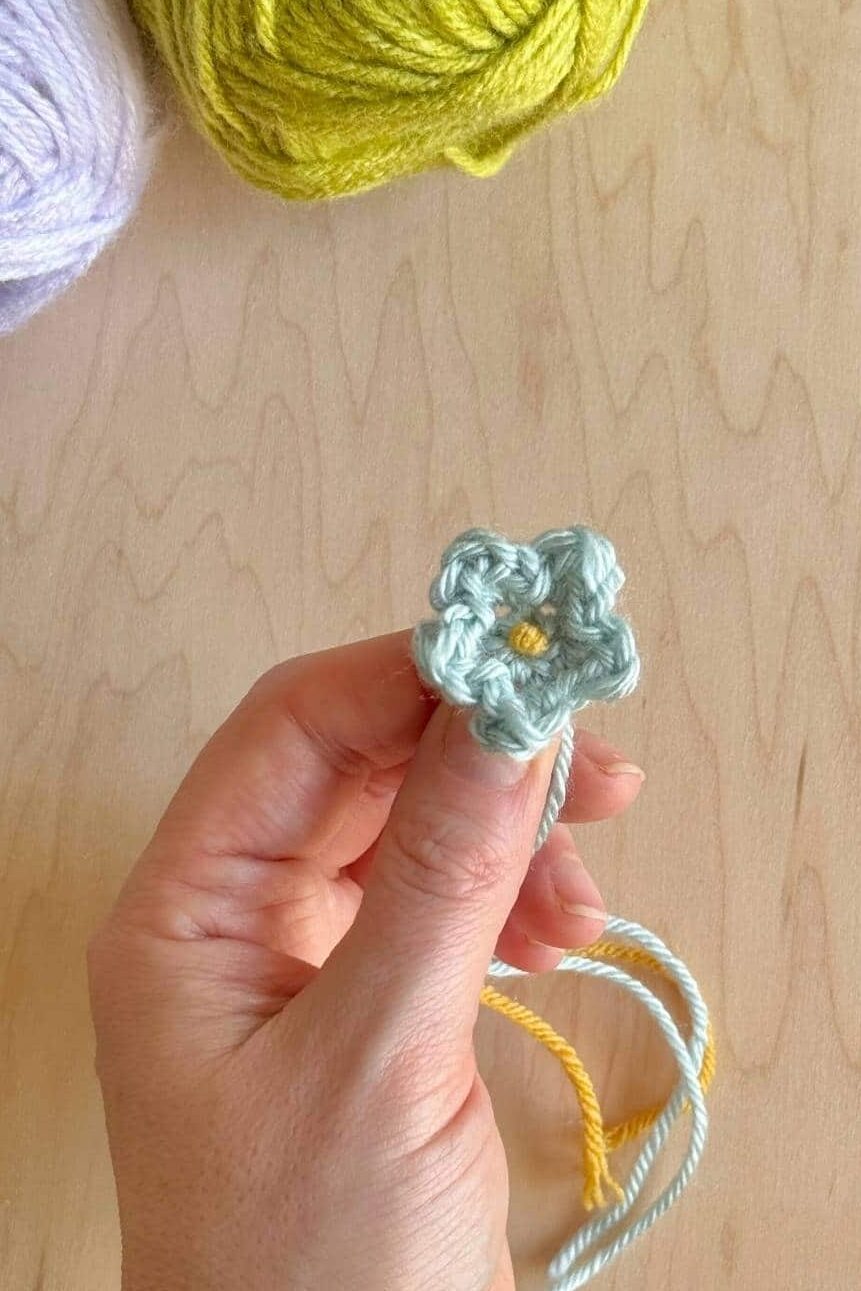 Finished crochet flower with center added.