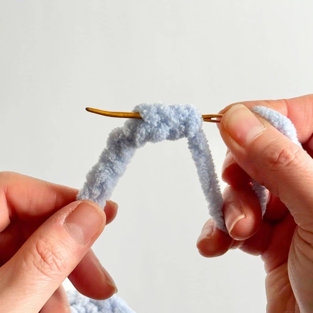 First step in finishing off ties on a crochet dress.