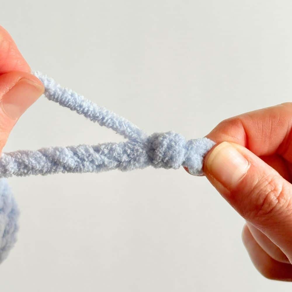 Pulling knot through on finishing ties step.