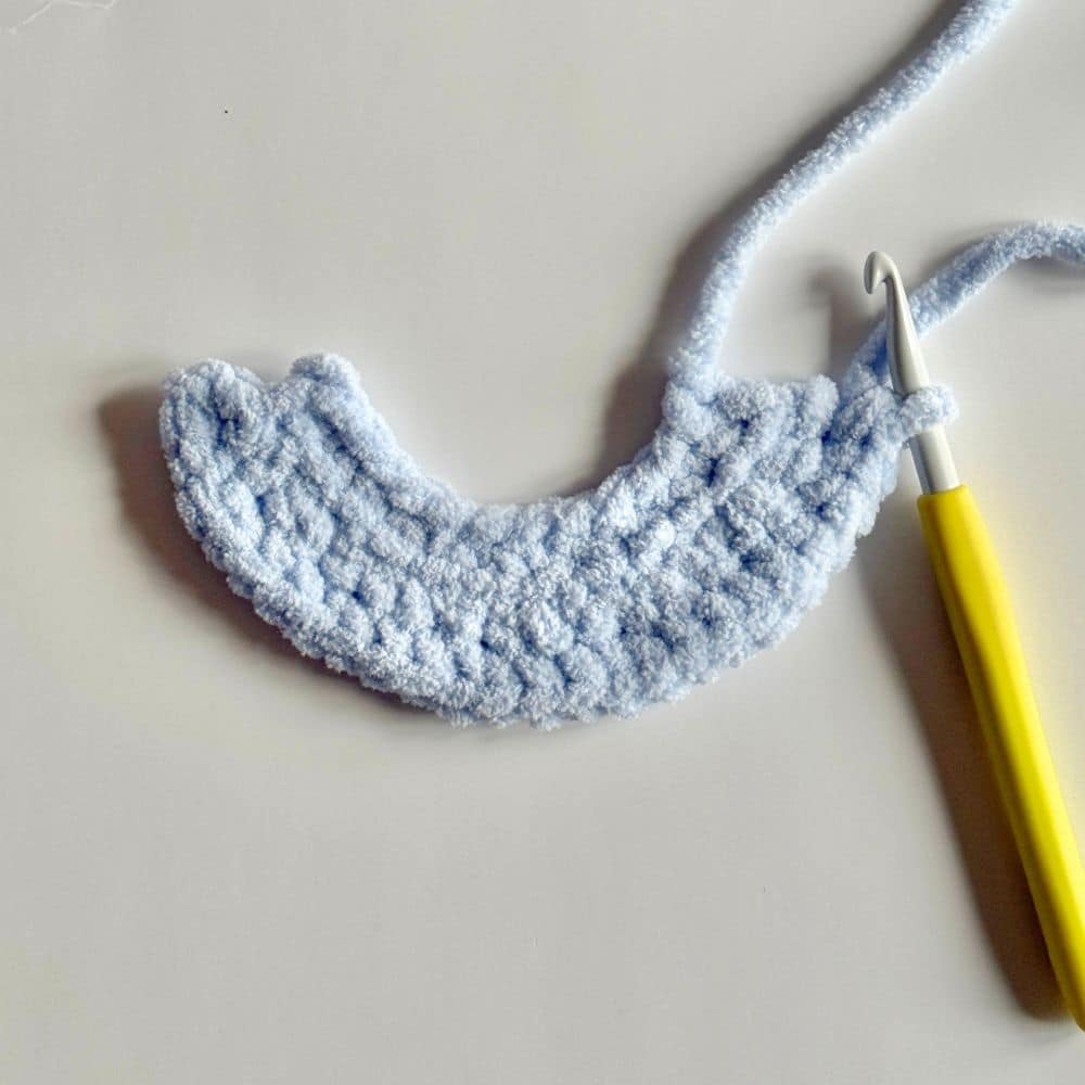 Top part of the crochet dress in blue.