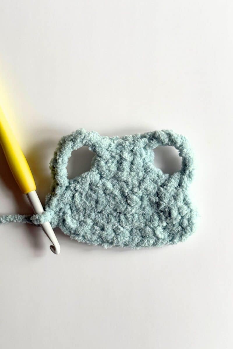 Finished arm holes on crochet vest.