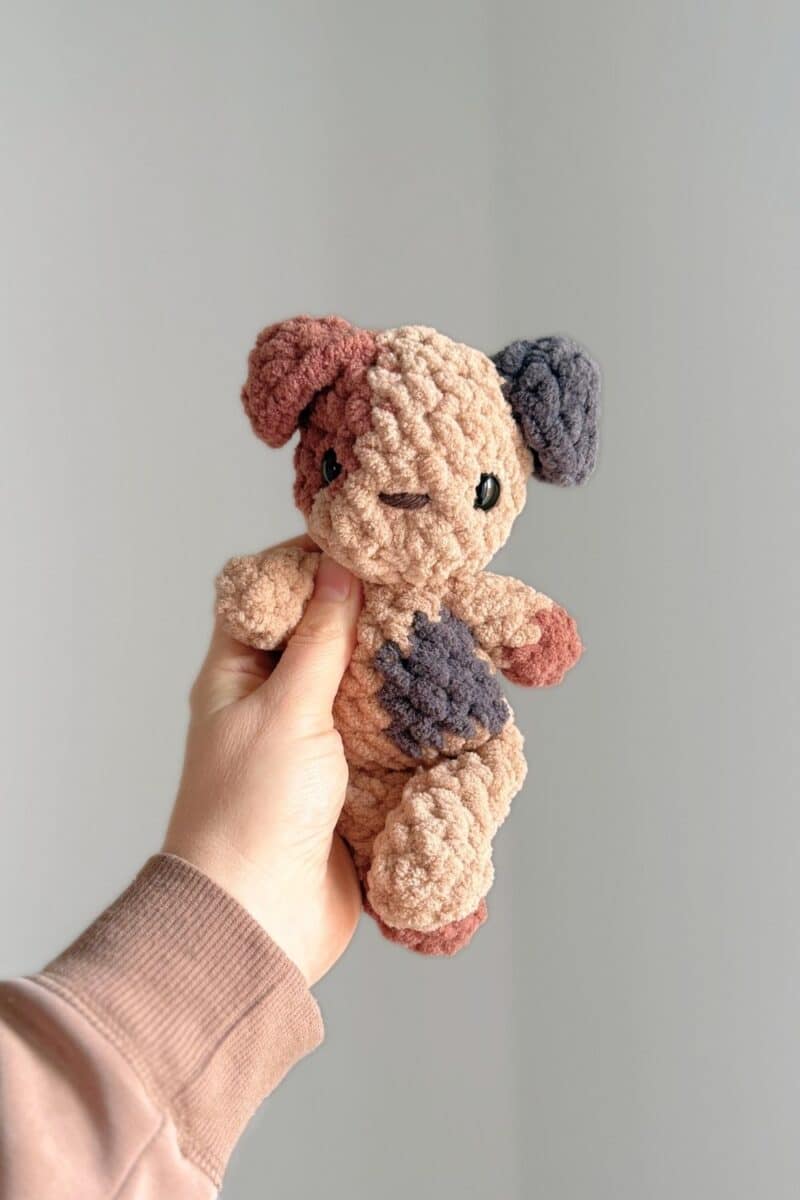 A brown spotted crochet puppy.