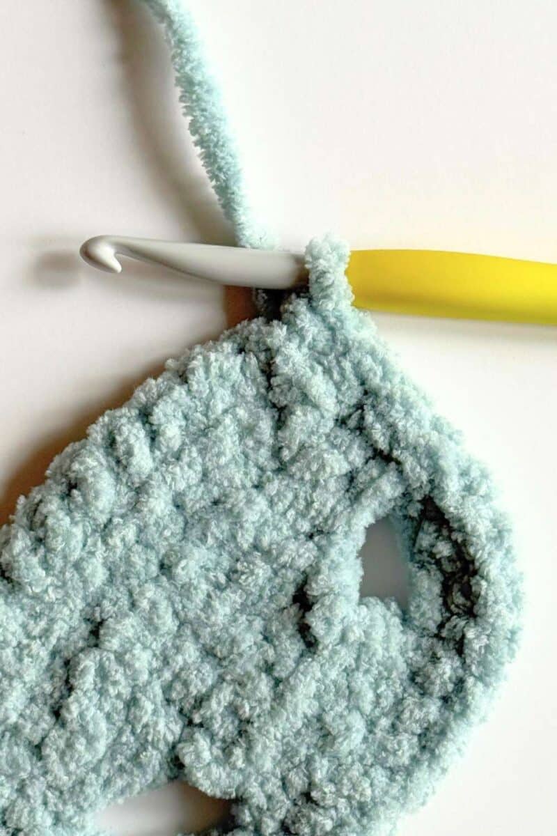 Completed corner on a crochet vest.