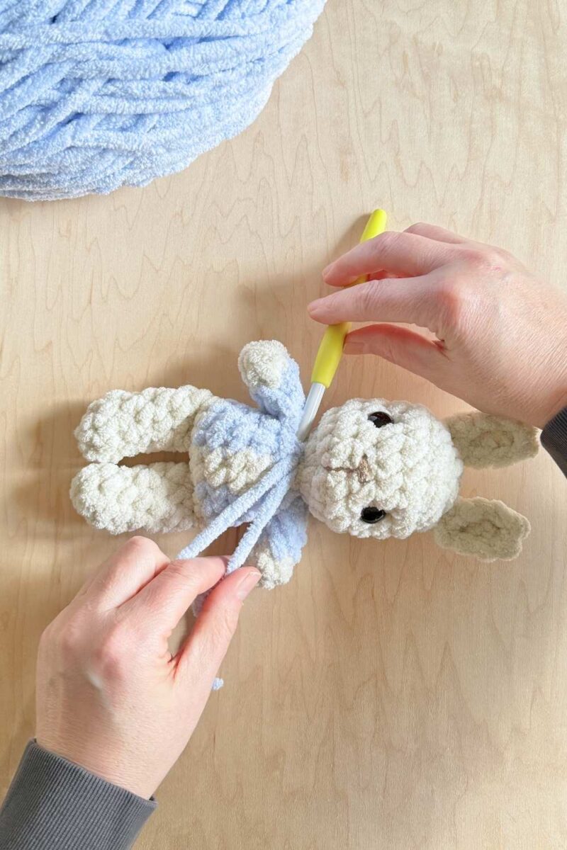 Process photo (second steps) of adding top stitching to a jacket on a Peter Rabbit bunny.