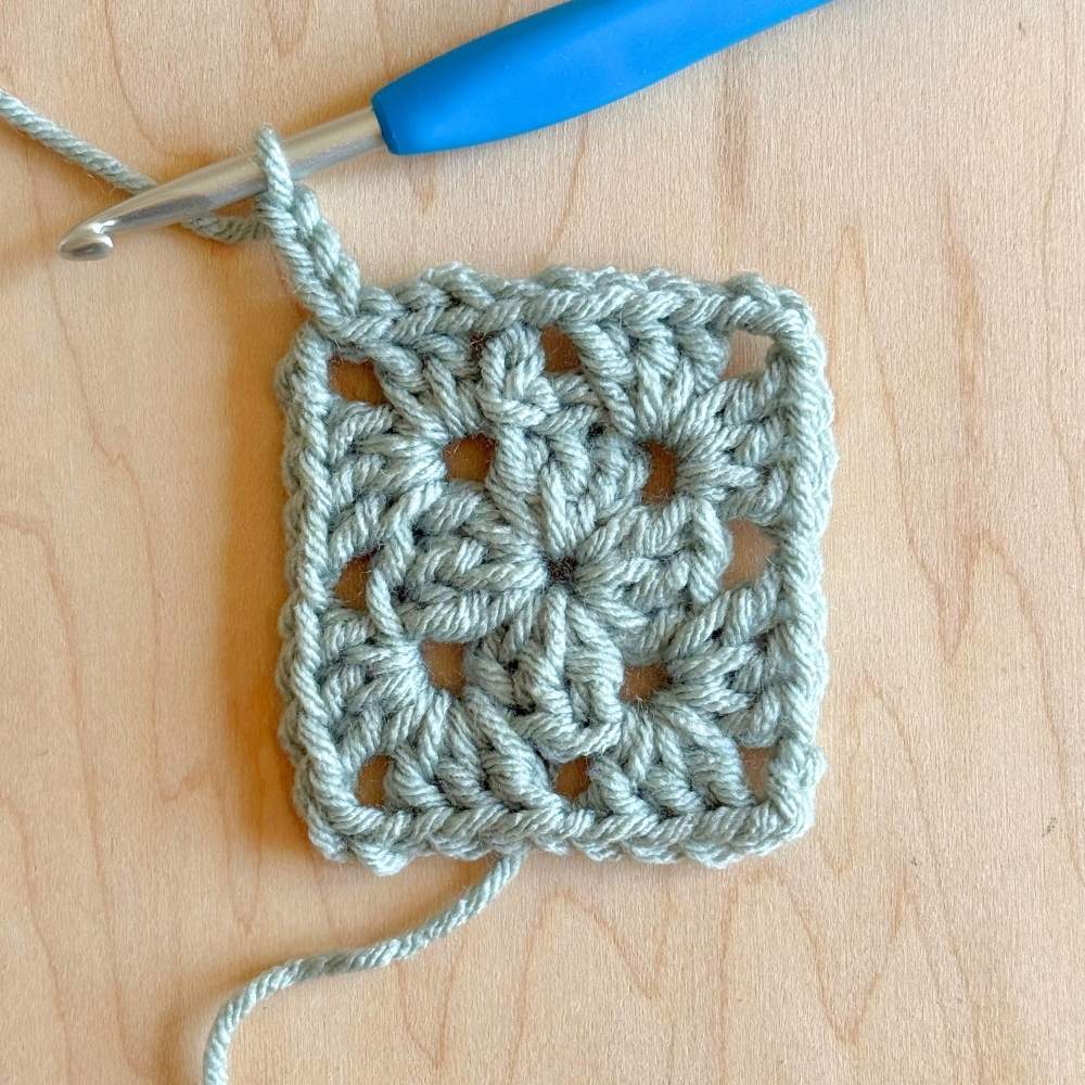 Process photo of 2nd round of blanket with chain in the corner. 