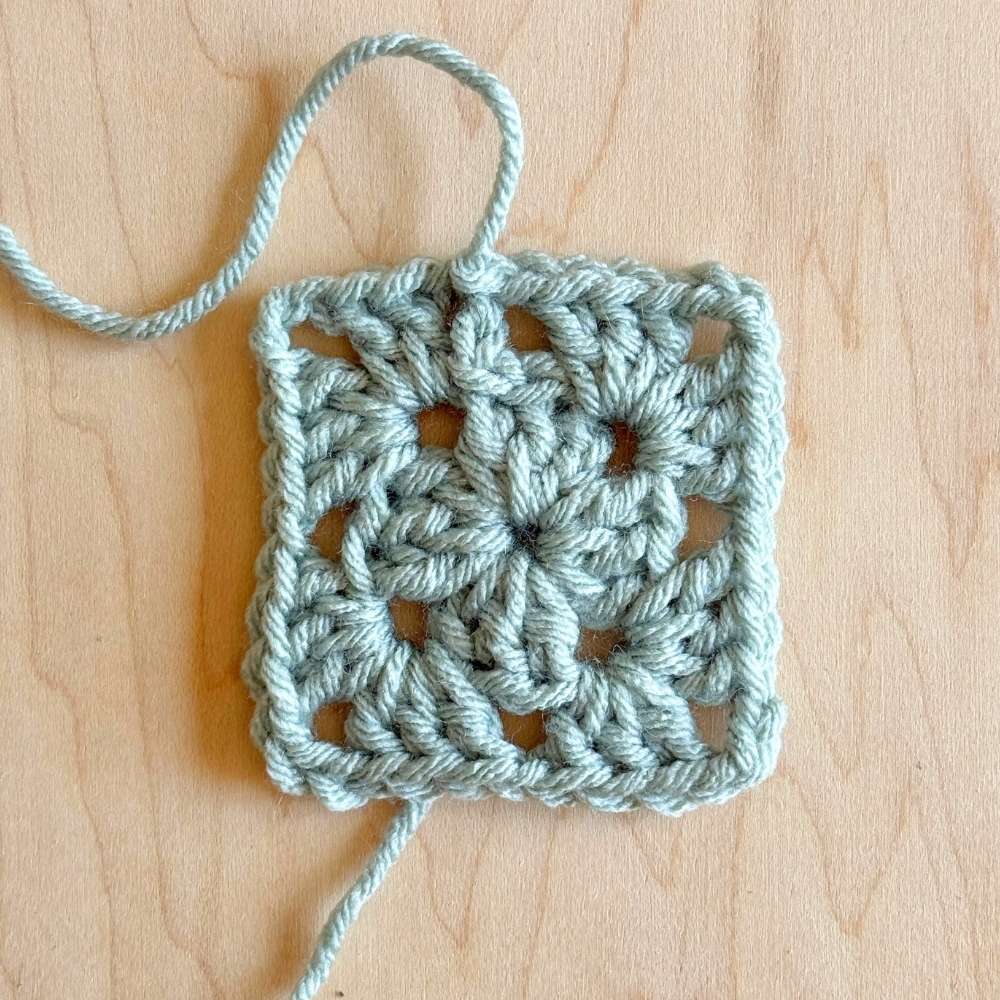 Process photo of 2nd round of blanket with yarn fastened off. 