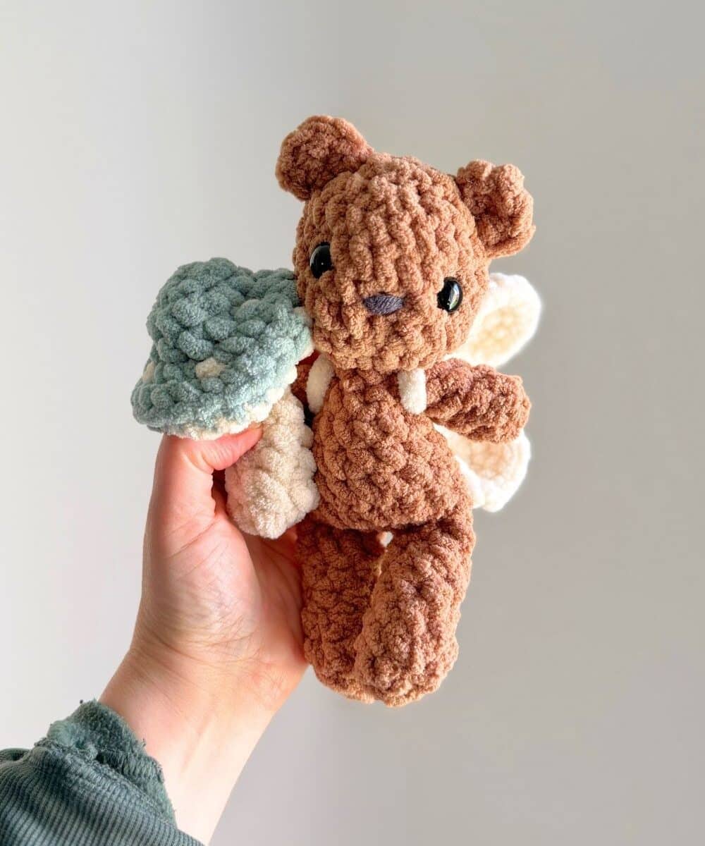 A crochet teddy bear with fairy wings