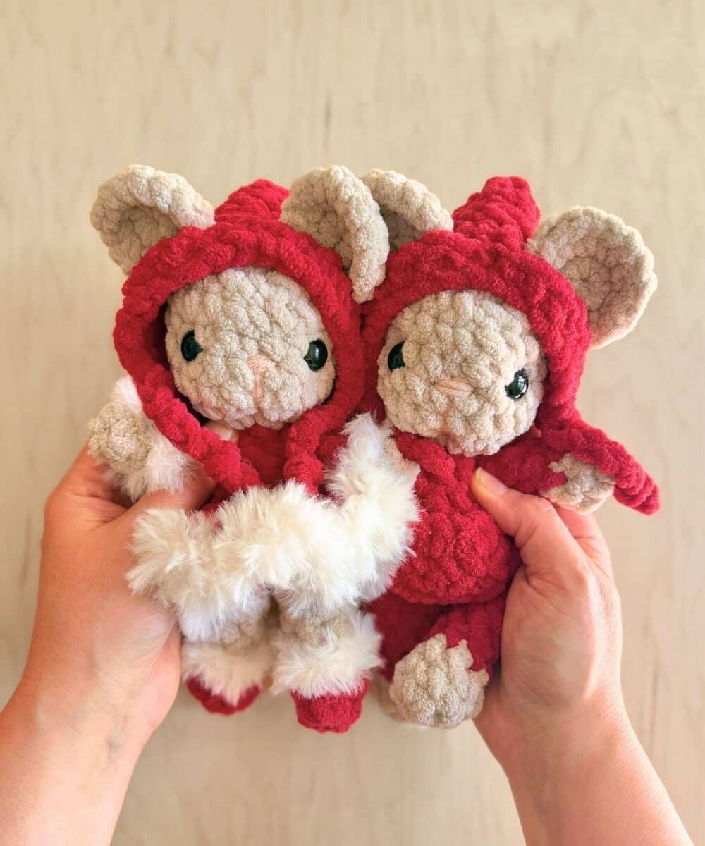 Two crochet Christmas mice in red and white.
