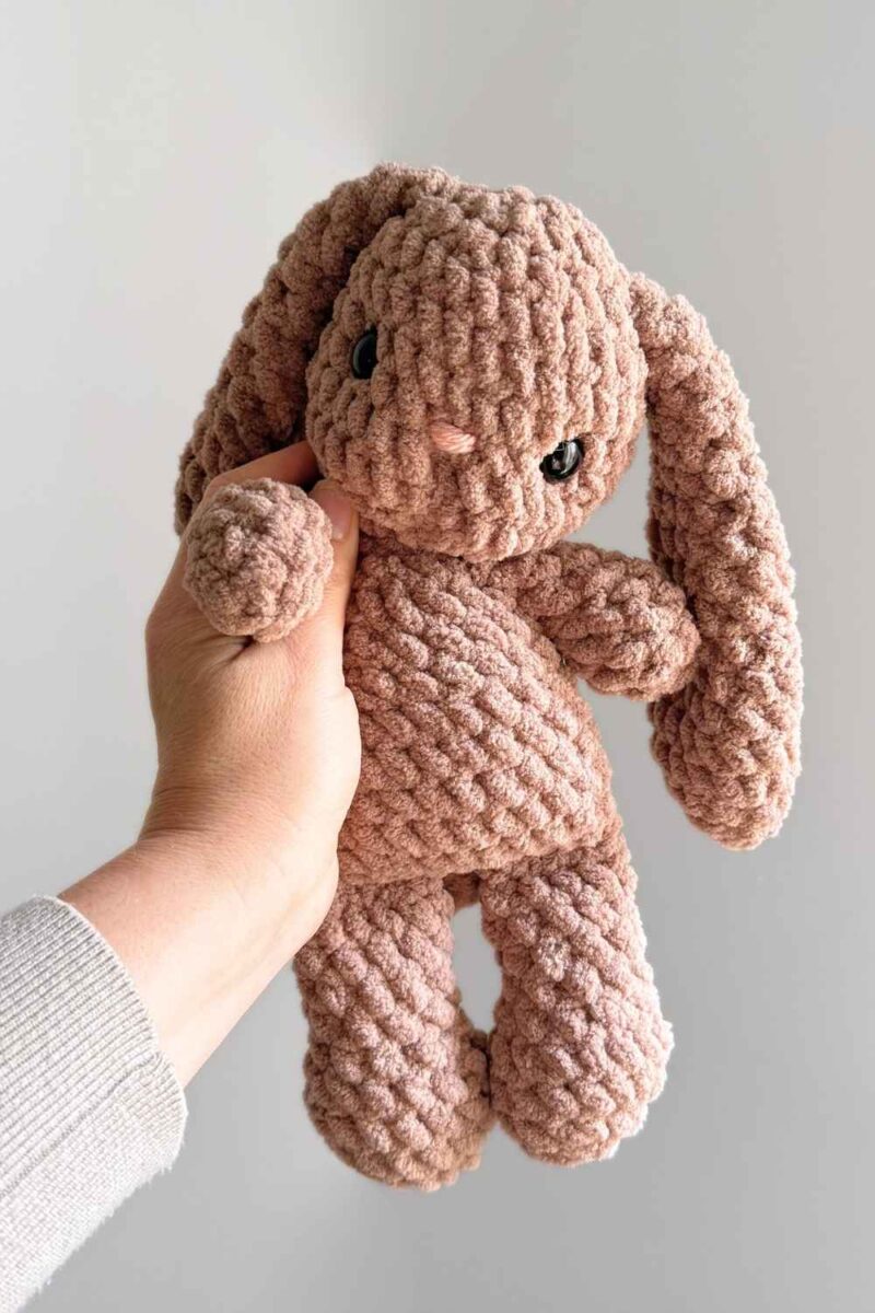 A brown crochet floppy bunny.