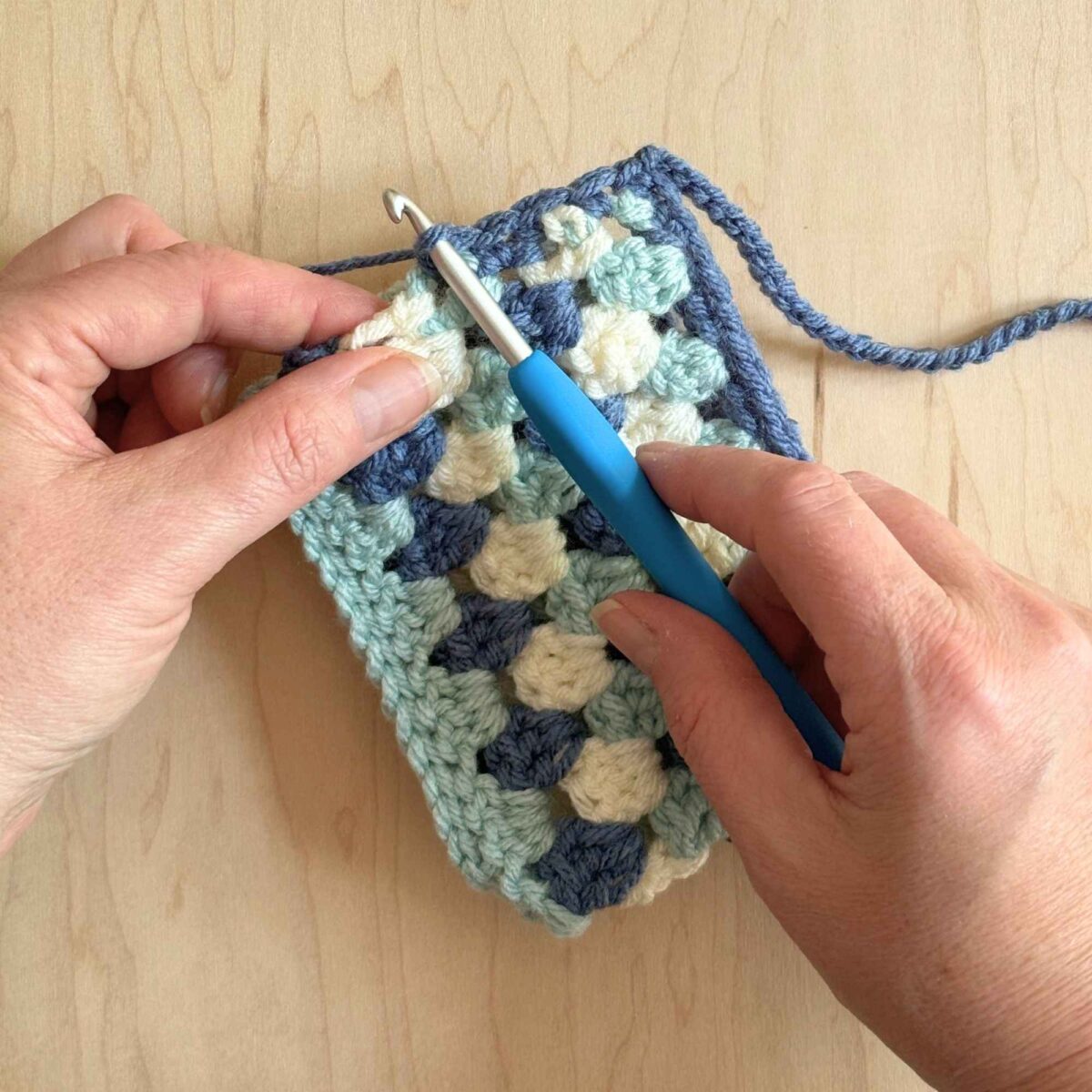 A photo showing how to add the hat ties.