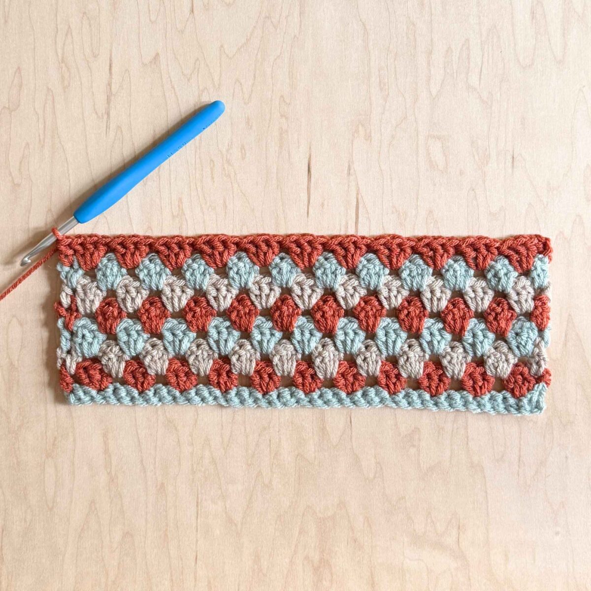 A finished photo of the crochet hat before closing and adding hat ties.