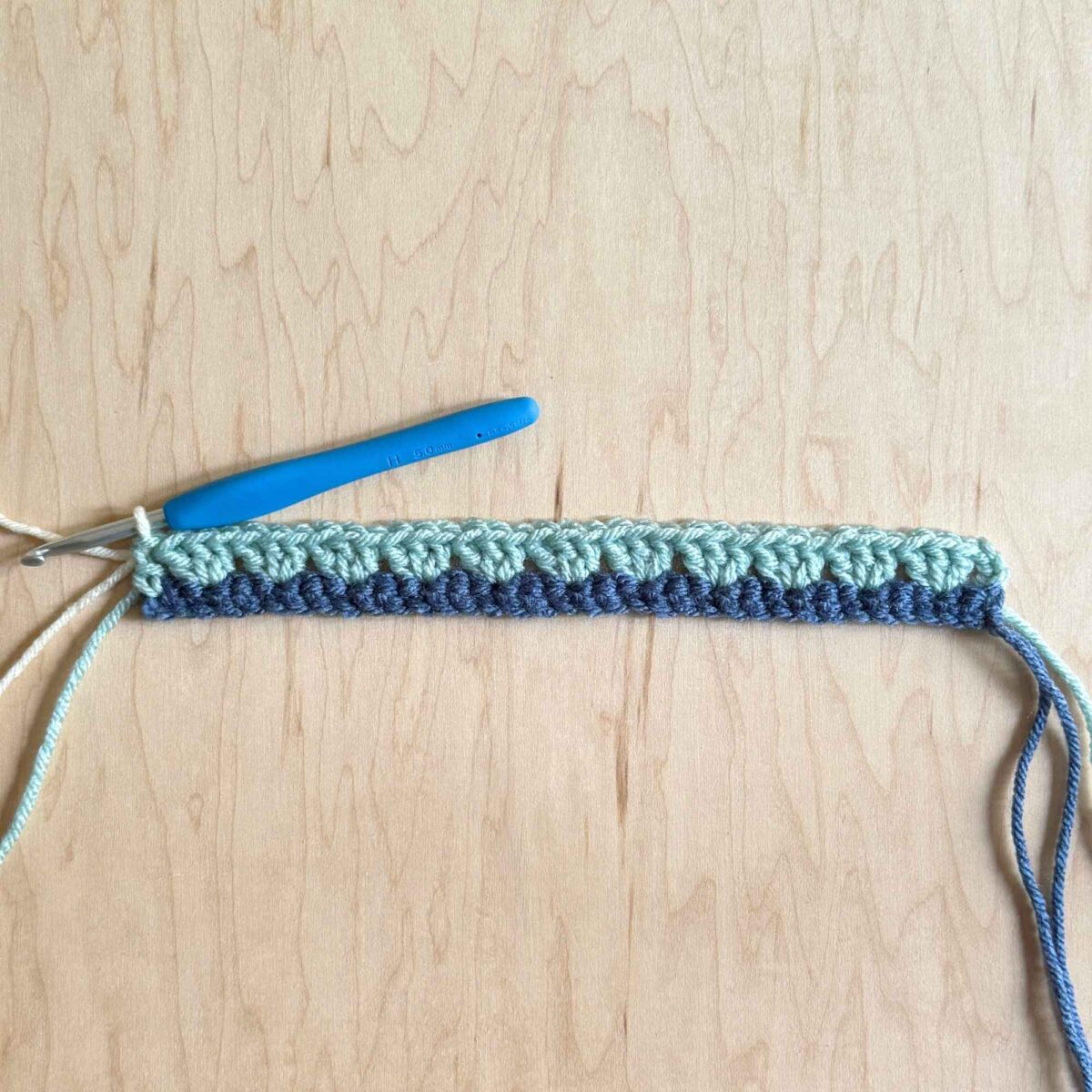 Photo showing the completed row 2 of the pixie hat.