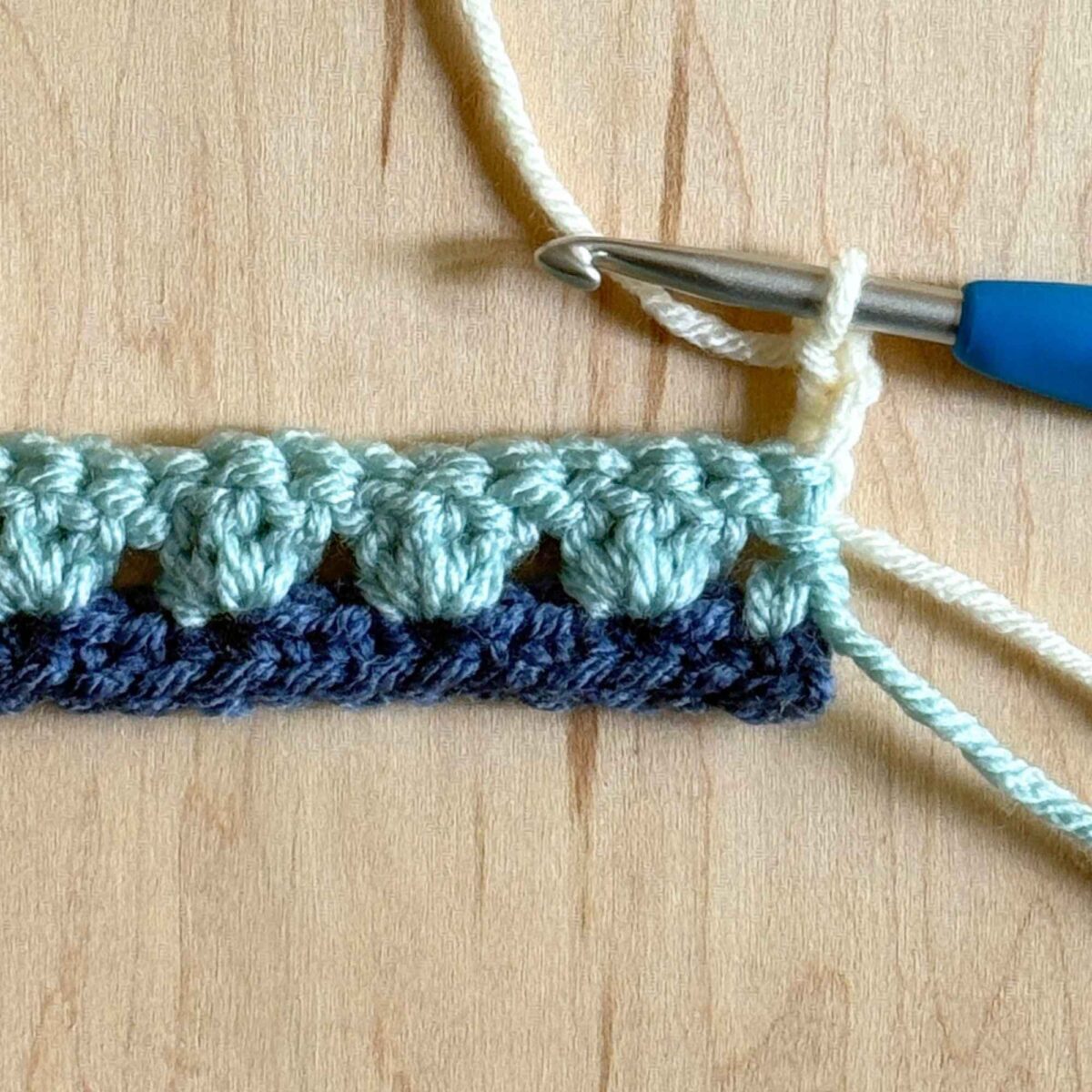 A process photo showing the first step of row 2 on the hat pattern.
