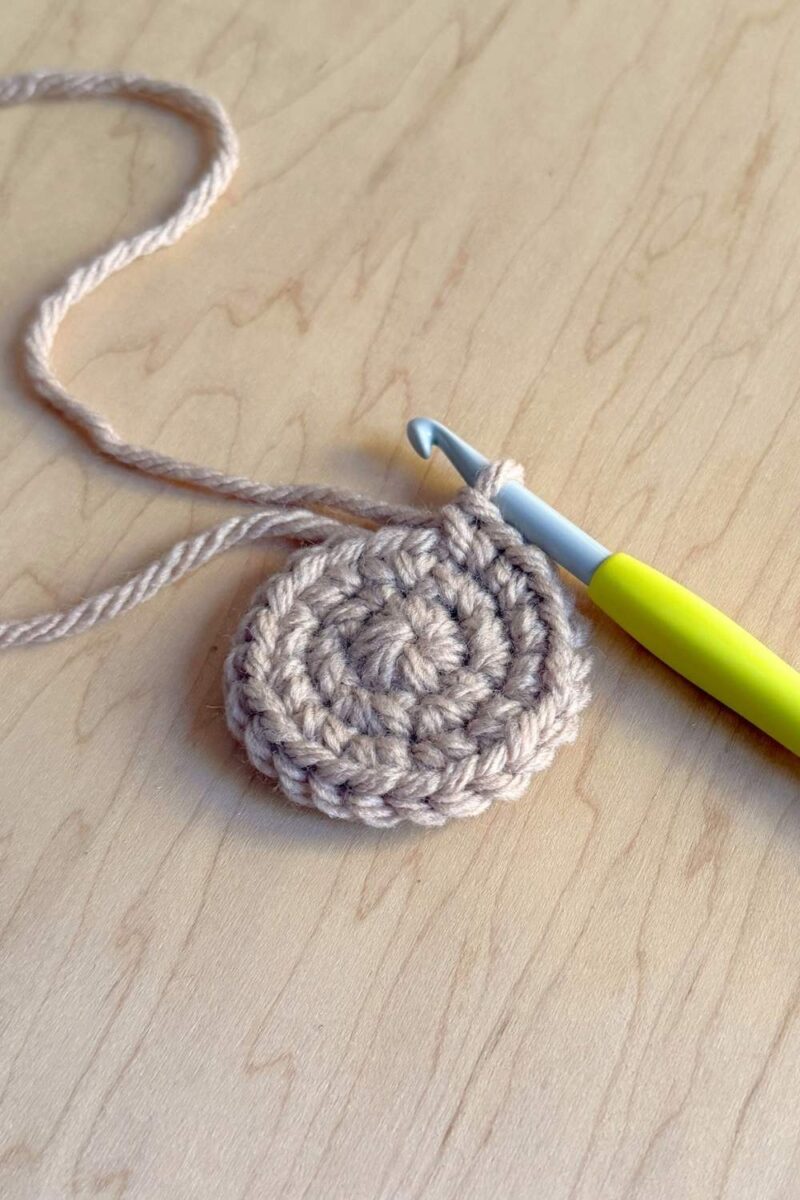 A process photo of a crochet cookie without chocolate chips.