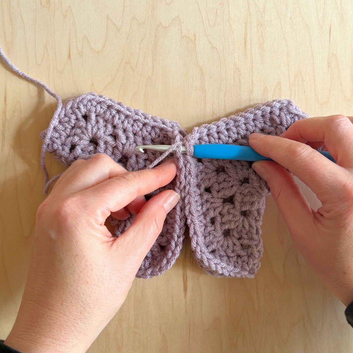 Photo showing where to place hook to close the sweater.